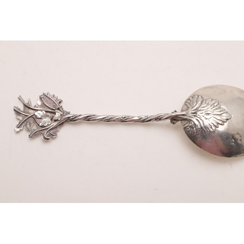 32 - A MODERN NATURALISTIC SPOON. with a birds nest finial, a twisted stem and engraved flowers to the bo... 