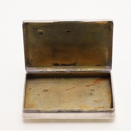 325 - A 19TH CENTURY AUSTRIAN PARCELGILT SNUFF BOX. rectangular form, the cover with a raised panel, decor... 