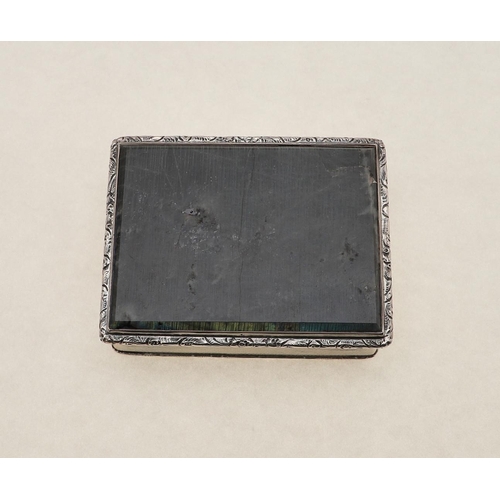 326 - A GEORGE VI RECTANGULAR SNUFF BOX. with floral scroll borders, the hinged cover inset with a panel o... 