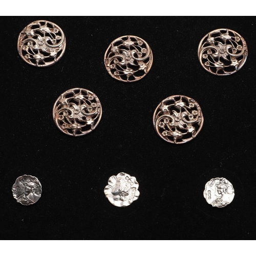 330 - BUTTONS:-. a set of 11 Edwardian buttons, with pierced floral decoration, by Lawrence Emanuel, Birmi... 