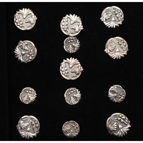 332 - BUTTONS:-. a set of 6 Edwardian buttons and 5 smaller in size, decorated with flowers against a matt... 