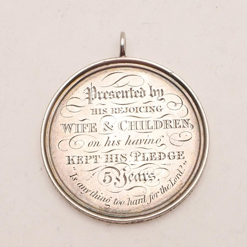 373 - A VICTORIAN TEMPERANCE MEDAL. circular with a suspensory ring, inscribed on one side 