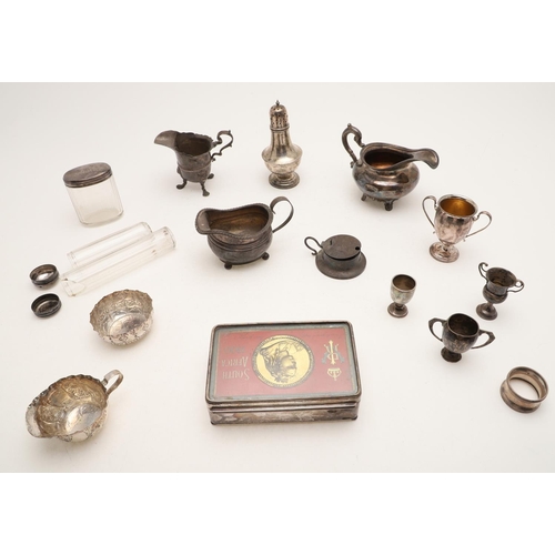 376 - A MIXED LOT. including: 3 milk jugs, a vase-shaped sugar caster, 4 small trophy cups, a napkin ring,... 