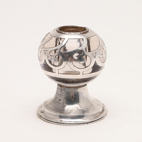 385 - AN EDWARDIAN GLASS MOUNTED MATCH HOLDER/ VESTA BALL. with applied silver decoration and raised on a ... 