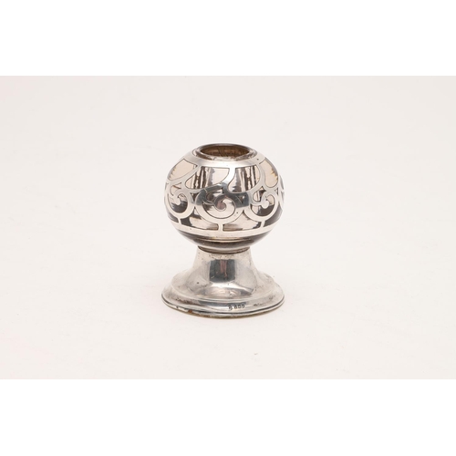 385 - AN EDWARDIAN GLASS MOUNTED MATCH HOLDER/ VESTA BALL. with applied silver decoration and raised on a ... 