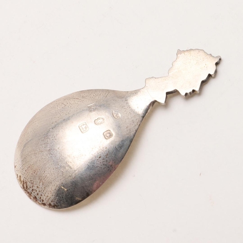 39 - A CASED MODERN COMMEMORATIVE CADDY SPOON, BY A. E JONES. the terminal in the form of Queen Elizabeth... 