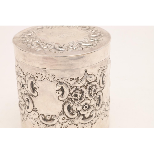 411 - A LATE VICTORIAN EMBOSSED CANNISTER. cylindrical form, decorated in relief with floral scrolls, with... 