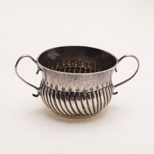 415 - A QUEEN ANNE MINIATURE OR TOY PORRINGER. with a wrythen-fluted lower body and twin scroll handles, i... 