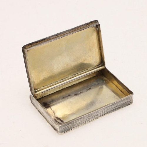 423 - AN 18TH CENTURY SNUFF BOX. in the form of a book, with a concealed hinge and engraved to simulate to... 