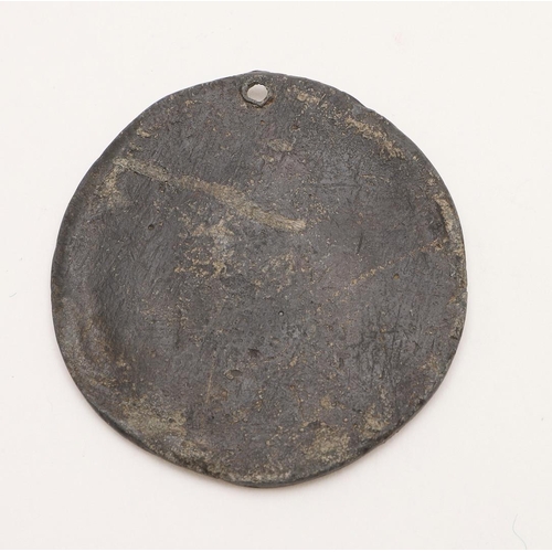 428 - AN 18TH CENTURY LEAD MEDALLION OR SEAL. circular with a drilled suspensory hole, decorated in relief... 