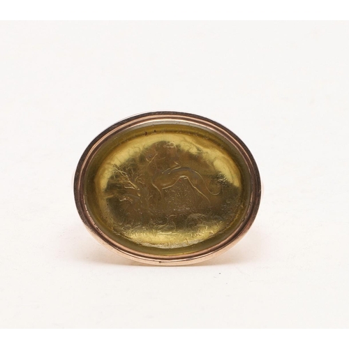 429 - A 19TH CENTURY GOLD FOB SEAL. with an oval matrix and intaglio with greyhounds in a landscape scene ... 