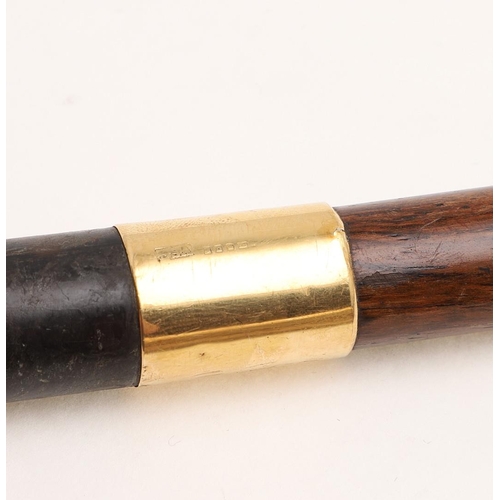 433 - AN EARLY 20TH CENTURY 18CT. GOLD MOUNTED WALKING CANE. initialled 