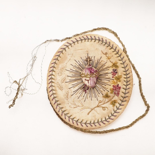 437 - A LATE 18TH/ EARLY 19TH CENTURY NEEDLEWORK MEDALLION. oval, worked in coloured silks, on one side wi... 