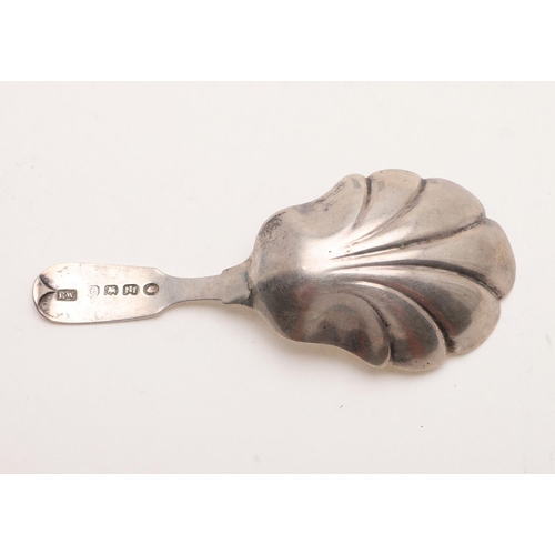 46 - A WILLIAM IV PROVINCIAL CADDY SPOON. Fiddle Pattern, with a shaped fluted bowl and the terminal engr... 