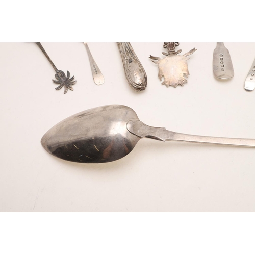 50 - A GEORGE III FIDDLE PATTERN SERVING SPOON. by Thomas Dicks, London 1807, together with 7 teaspoons, ... 