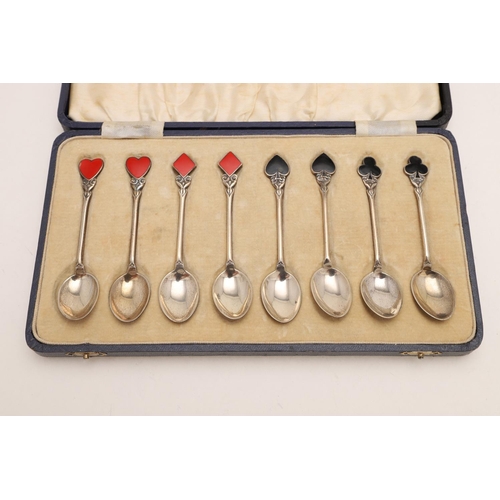 73 - THREE CASED SETS OF TEASPOONS. a set of eight, with enamelled French suits at the terminals, by Turn... 