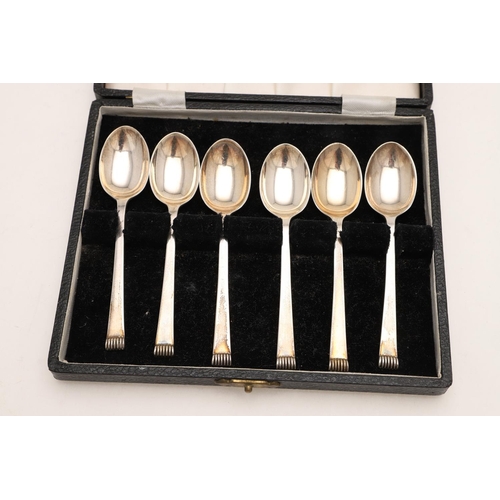 73 - THREE CASED SETS OF TEASPOONS. a set of eight, with enamelled French suits at the terminals, by Turn... 