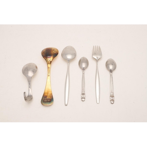 84 - BY GEORG JENSEN:-. a pair of Acorn Pattern teaspoons, a No. 12 Pattern spoon, a silvergilt 