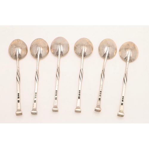 86 - A GEORGE V CASED SET OF SIX TEASPOONS, BY OMAR RAMSDEN. with twist stems and a spot hammered finish,... 