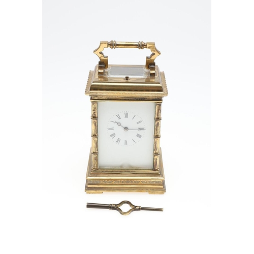 1424 - A LARGE FRENCH BRASS REPEATING CARRIAGE CLOCK. the brass two train movement stamped serial number '1... 