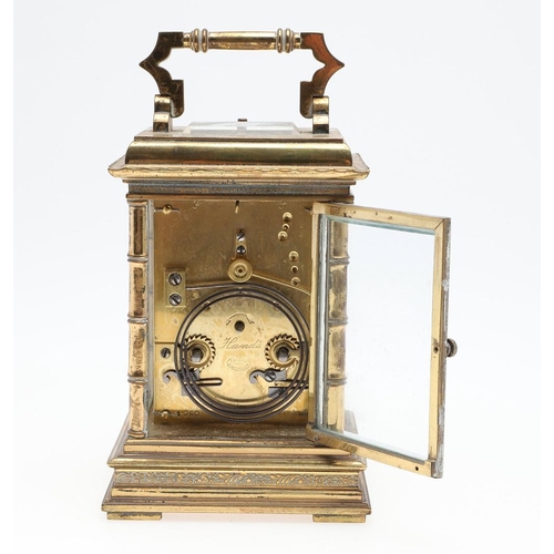 1424 - A LARGE FRENCH BRASS REPEATING CARRIAGE CLOCK. the brass two train movement stamped serial number '1... 