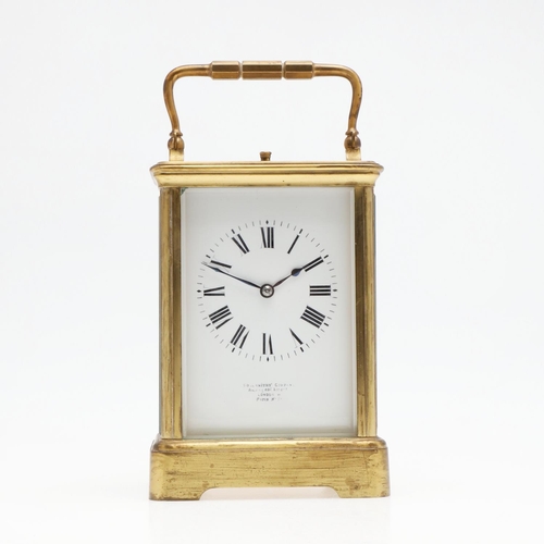 1426 - AN EARLY 20TH CENTURY FRENCH BRASS REPEATING CARRIAGE CLOCK. the enamel dial signed Goldsmiths' Comp... 