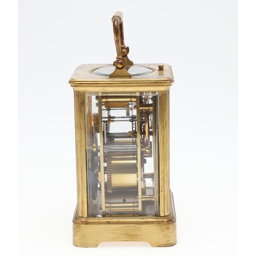 1426 - AN EARLY 20TH CENTURY FRENCH BRASS REPEATING CARRIAGE CLOCK. the enamel dial signed Goldsmiths' Comp... 