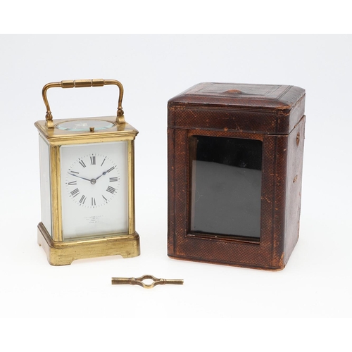 1426 - AN EARLY 20TH CENTURY FRENCH BRASS REPEATING CARRIAGE CLOCK. the enamel dial signed Goldsmiths' Comp... 