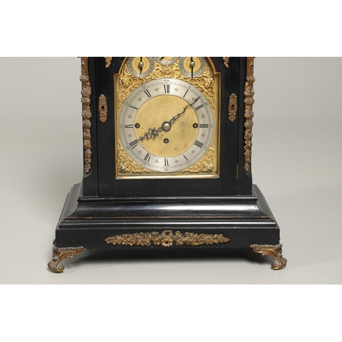 1432 - A GEORGE II STYLE EBONISED AND GILT METAL MOUNTED THREE TRAIN BRACKET CLOCK. the 7