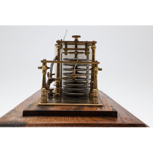 1440 - AN EARLY 20TH CENTURY OAK CASED BAROGRAPH. with silvered bellows and single drawer for papers, heigh... 