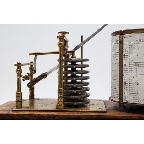 1440 - AN EARLY 20TH CENTURY OAK CASED BAROGRAPH. with silvered bellows and single drawer for papers, heigh... 