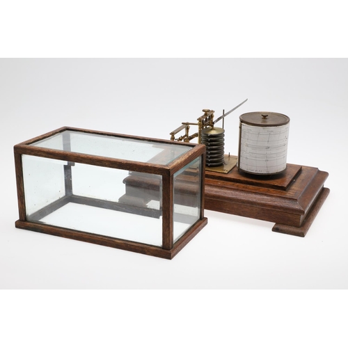 1440 - AN EARLY 20TH CENTURY OAK CASED BAROGRAPH. with silvered bellows and single drawer for papers, heigh... 