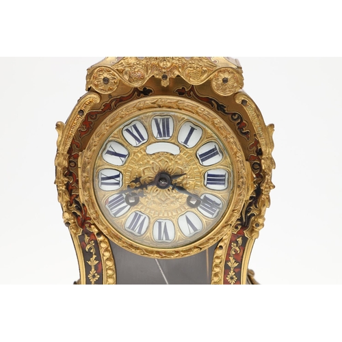 1444 - A 19TH CENTURY FRENCH BOULLE MANTEL CLOCK. the case with tortoiseshell and pierced brass overlay, en... 