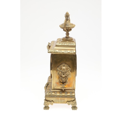 1446 - A FRENCH GILT BRASS MANTEL CLOCK. the 4