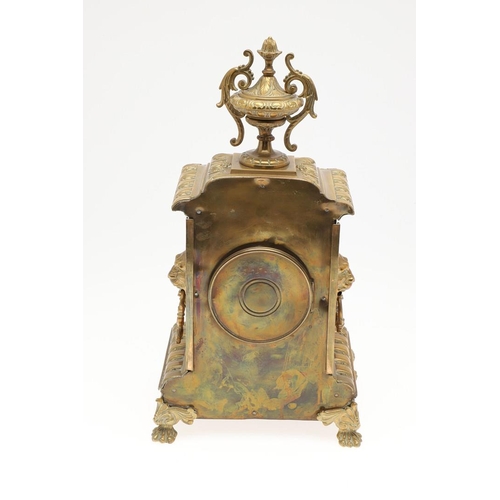 1446 - A FRENCH GILT BRASS MANTEL CLOCK. the 4