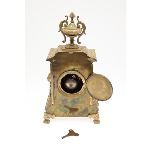 1446 - A FRENCH GILT BRASS MANTEL CLOCK. the 4