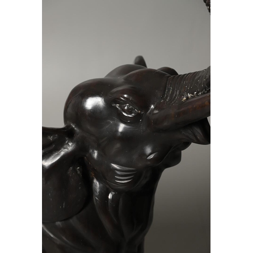 1452 - A PAIR OF LARGE BRONZE ELEPHANTS. hollow cast, modelled charging with trunks raised, height 125cm, l... 