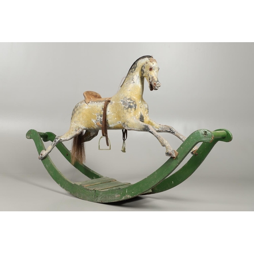 1460 - A 19TH CENTURY PAINTED ROCKING HORSE. the dapple grey painted body with glass eyes, horse hair tail ... 