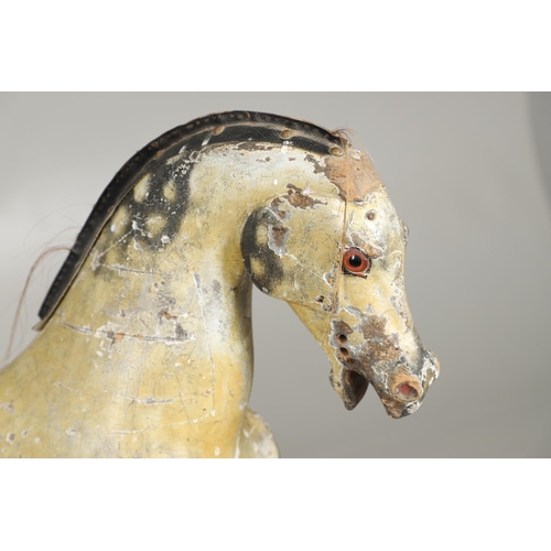 1460 - A 19TH CENTURY PAINTED ROCKING HORSE. the dapple grey painted body with glass eyes, horse hair tail ... 