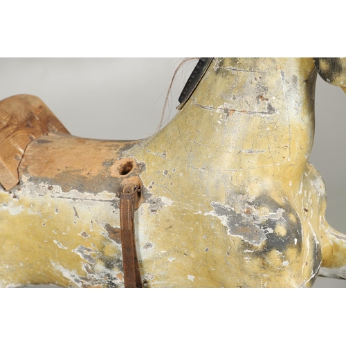 1460 - A 19TH CENTURY PAINTED ROCKING HORSE. the dapple grey painted body with glass eyes, horse hair tail ... 