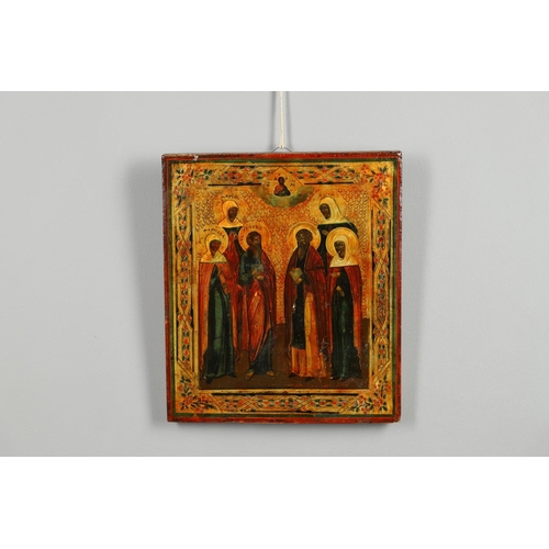 1462 - A PAIR OF RUSSIAN ICONS. 20th century, depicting saintly figures between stylised gilt borders, 31cm... 