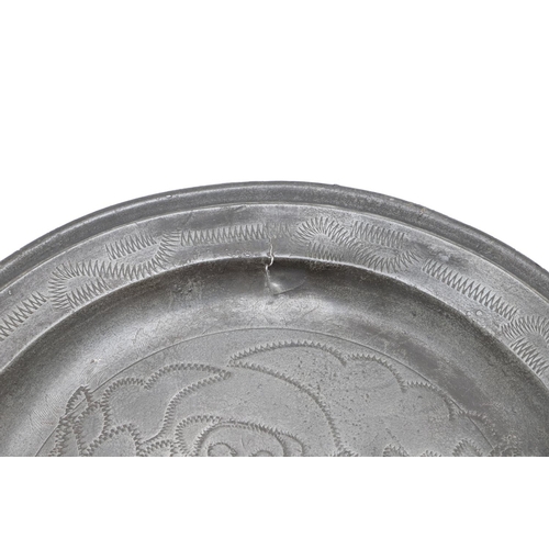 1466 - AN EARLY 18TH CENTURY ENGLISH PEWTER PLATE. with wrigglework decoration of an owl and foliage, stamp... 