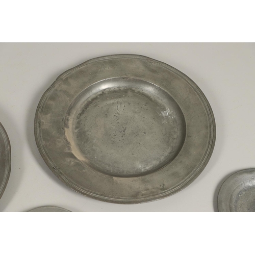 1468 - A PAIR OF LARGE 18TH CENTURY PEWTER PLATES. the rims with reeded border, stamped maker's mark to ver... 