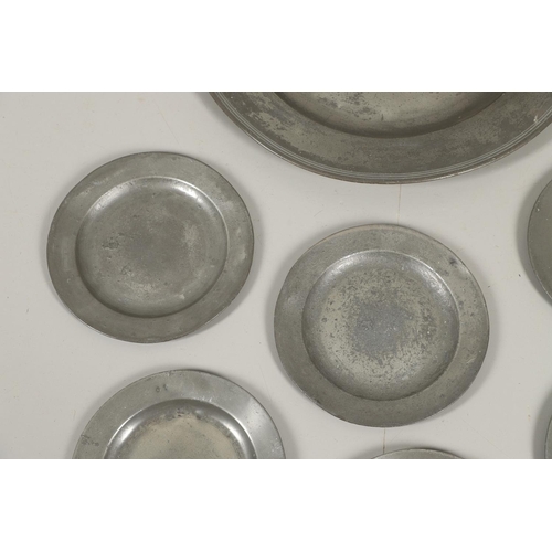 1468 - A PAIR OF LARGE 18TH CENTURY PEWTER PLATES. the rims with reeded border, stamped maker's mark to ver... 