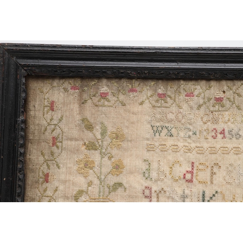 1476 - AN EARLY 19TH CENTURY NEEDLEWORK SAMPLER. depicting flowers and fruiting trees in planters flanked b... 