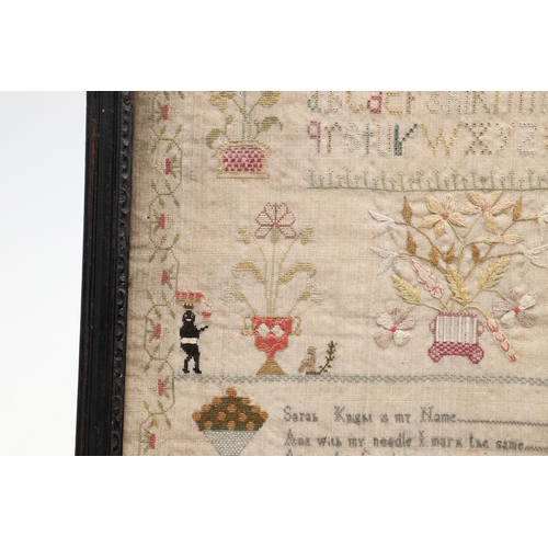 1476 - AN EARLY 19TH CENTURY NEEDLEWORK SAMPLER. depicting flowers and fruiting trees in planters flanked b... 