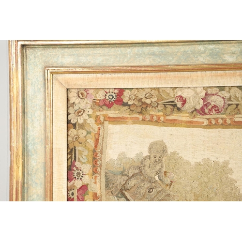 1478 - AN 18TH CENTURY FRENCH NEEDLEWORK PANEL. depicting figures and their dog playing in a garden setting... 