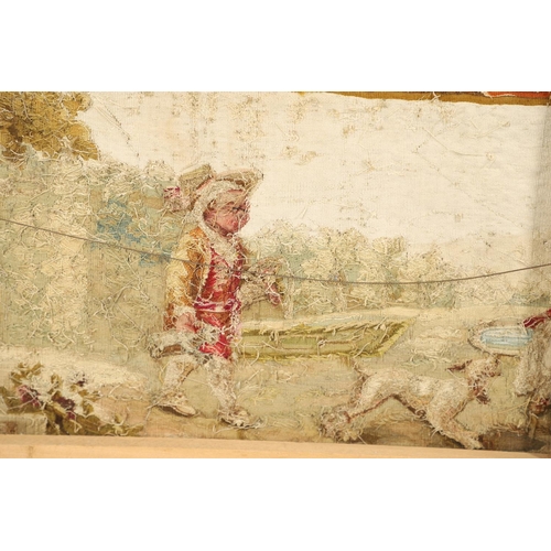 1478 - AN 18TH CENTURY FRENCH NEEDLEWORK PANEL. depicting figures and their dog playing in a garden setting... 