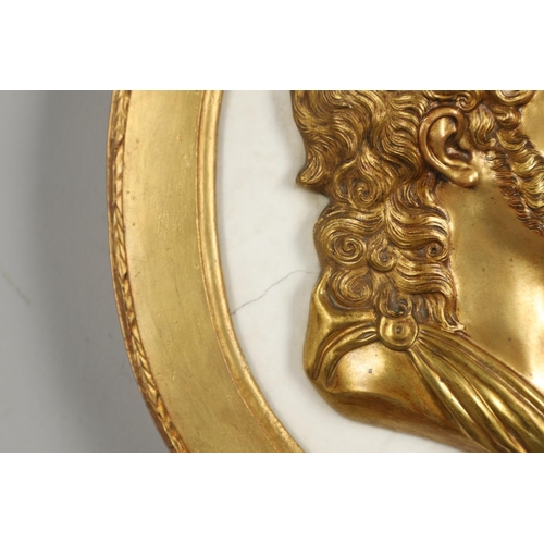 1491 - A 19TH CENTURY OVAL MARBLE AND GILT METAL PORTRAIT PLAQUE. the white marble mounted with a head of a... 