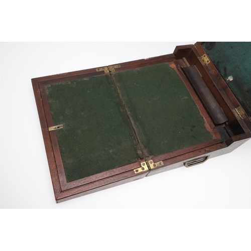 1494 - A 19TH CENTURY MAHOGANY AND BRASS BOUND WRITING SLOPE. in the Campaign style with recessed side hand... 